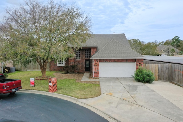 view of front of home with a garage and a front lawn