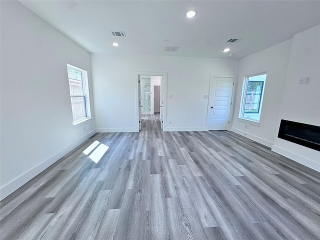 unfurnished living room with light hardwood / wood-style flooring