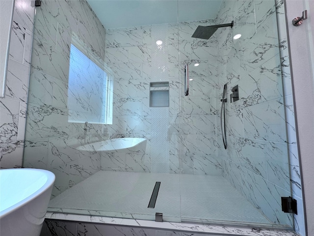 bathroom with separate shower and tub