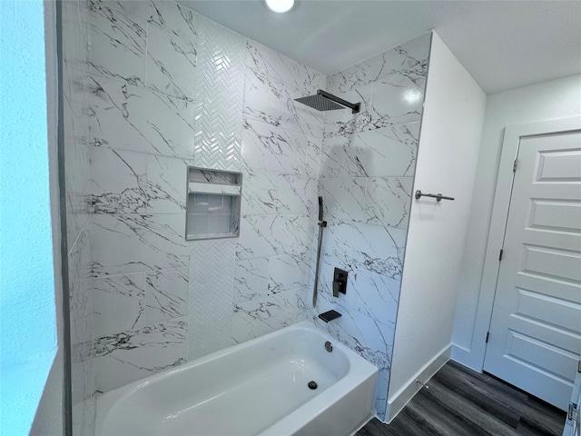 bathroom featuring hardwood / wood-style flooring and tiled shower / bath