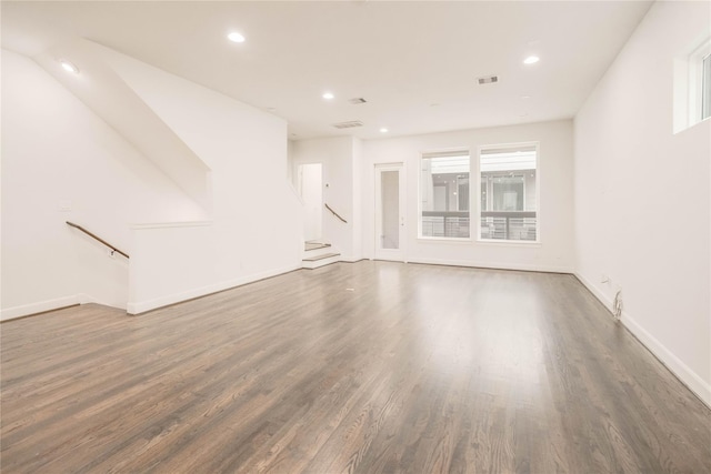 unfurnished living room featuring dark hardwood / wood-style floors