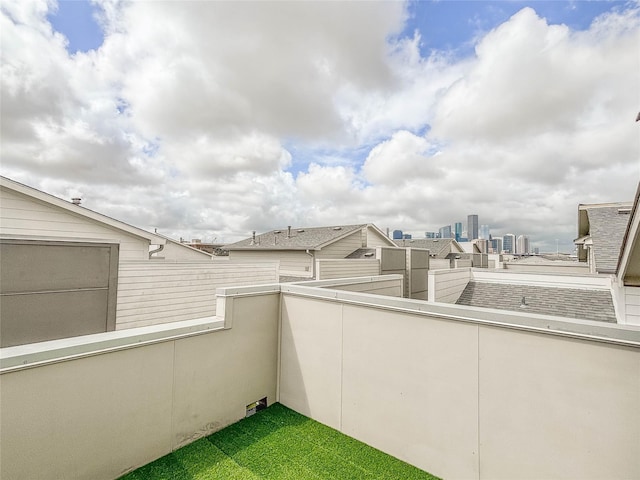 view of patio featuring a balcony