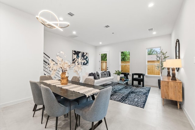 dining space with a notable chandelier