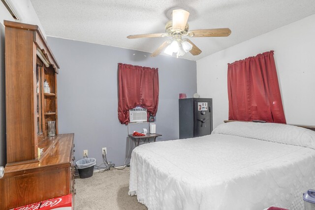 bedroom with a textured ceiling, ceiling fan, and cooling unit