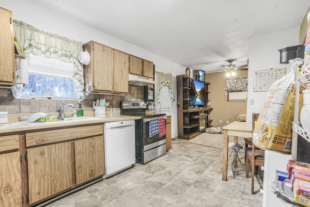 kitchen featuring ceiling fan, dishwasher, sink, stainless steel range with electric stovetop, and decorative backsplash