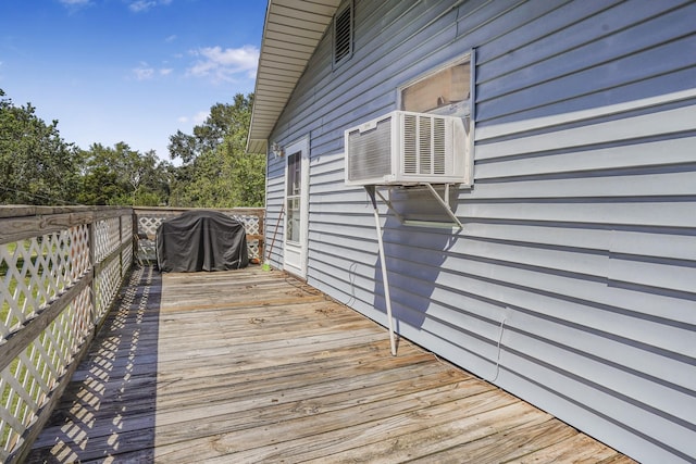 wooden terrace featuring grilling area