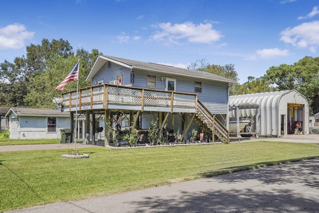 view of front of home featuring a wooden deck and a front lawn