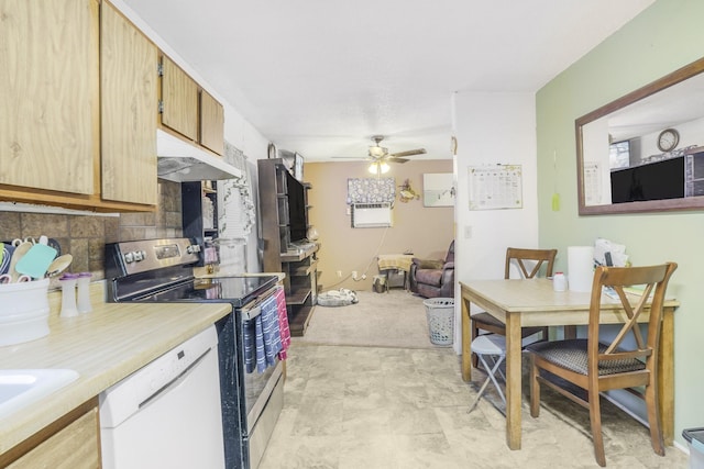 kitchen with backsplash, white dishwasher, ceiling fan, sink, and stainless steel range with electric cooktop