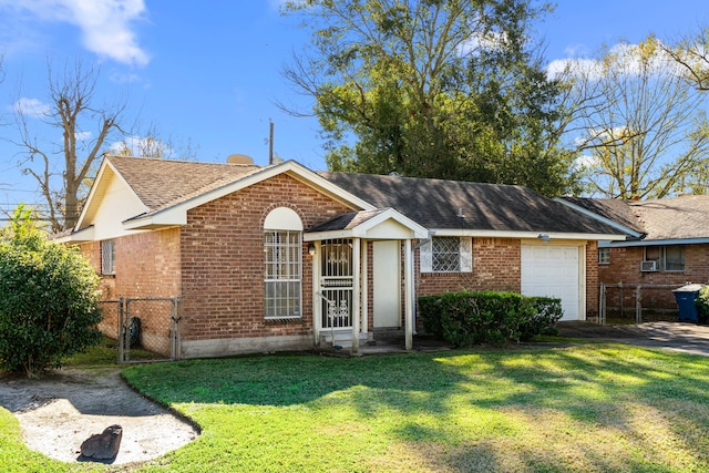 single story home featuring a garage and a front lawn