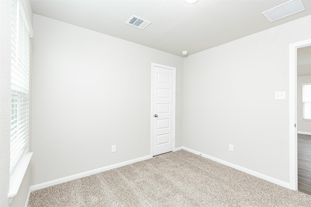 empty room with carpet floors