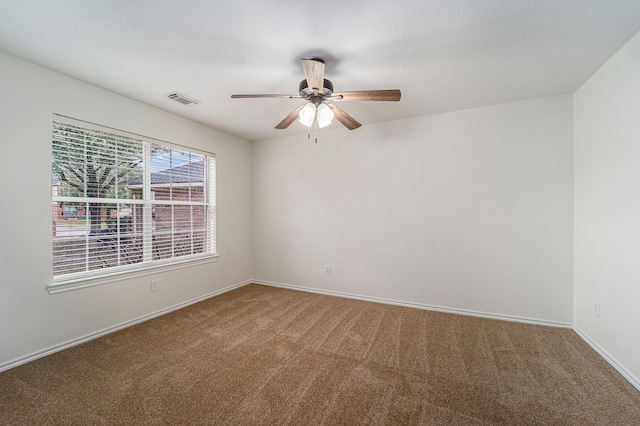 carpeted empty room with ceiling fan