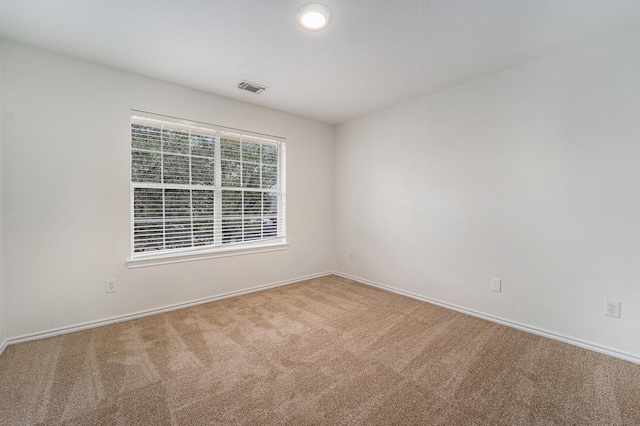 unfurnished room with carpet flooring