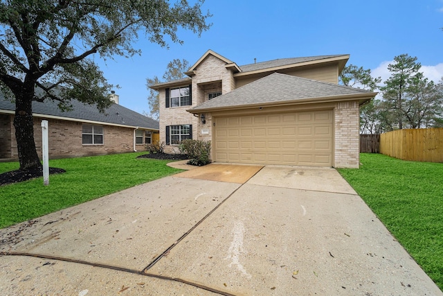 view of front facade with a garage and a front lawn