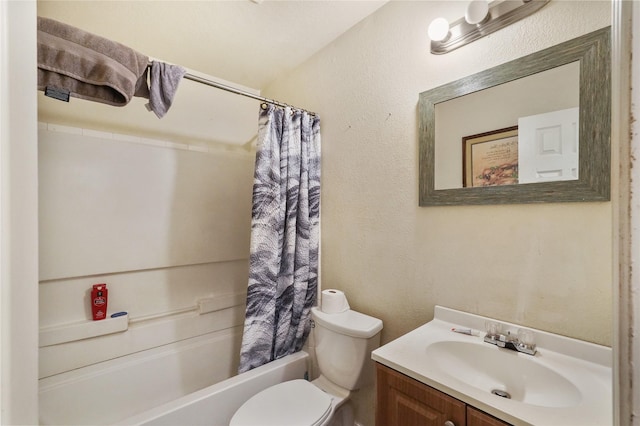 full bathroom with vanity, shower / bath combination with curtain, and toilet