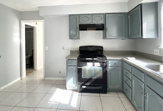 kitchen with gray cabinetry, black electric range oven, and light tile patterned floors