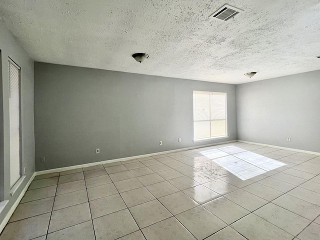 empty room with light tile patterned floors