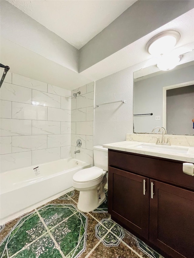 full bathroom with tiled shower / bath, vanity, and toilet