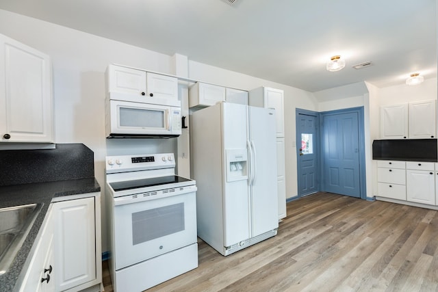 kitchen with white cabinetry, sink, tasteful backsplash, light hardwood / wood-style floors, and white appliances