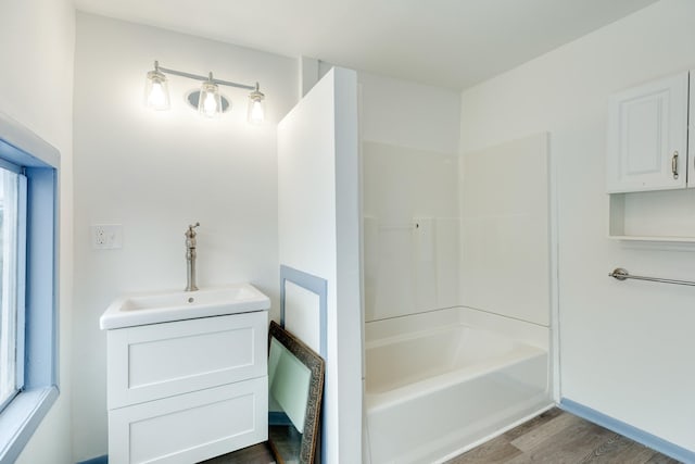 bathroom with vanity and hardwood / wood-style flooring