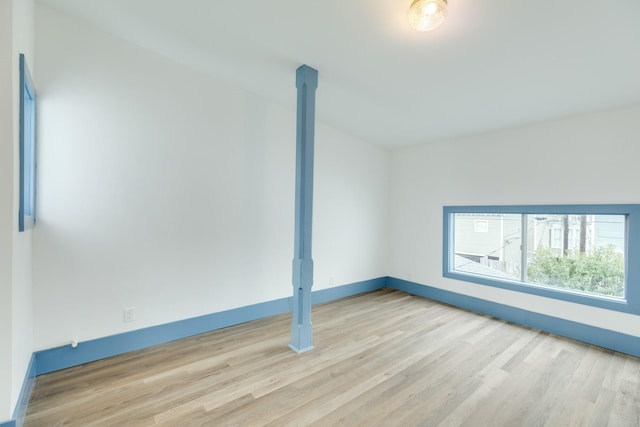 empty room with light hardwood / wood-style floors