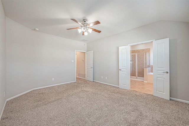 unfurnished bedroom with ceiling fan, lofted ceiling, and light carpet