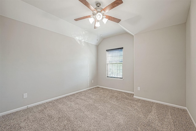 empty room with carpet flooring, ceiling fan, and lofted ceiling