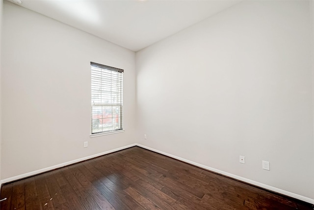 empty room with hardwood / wood-style flooring