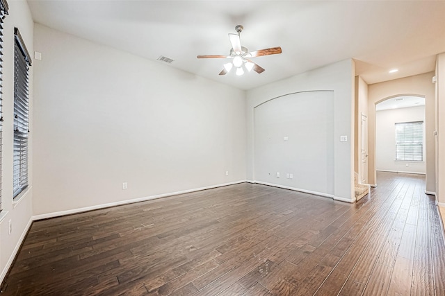 interior space featuring dark hardwood / wood-style flooring and ceiling fan