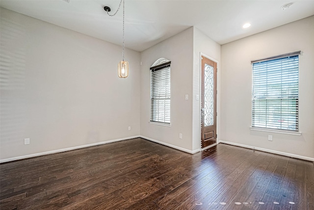 spare room featuring dark hardwood / wood-style floors