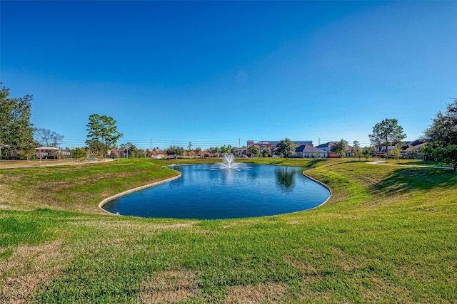 view of pool featuring a water view and a yard