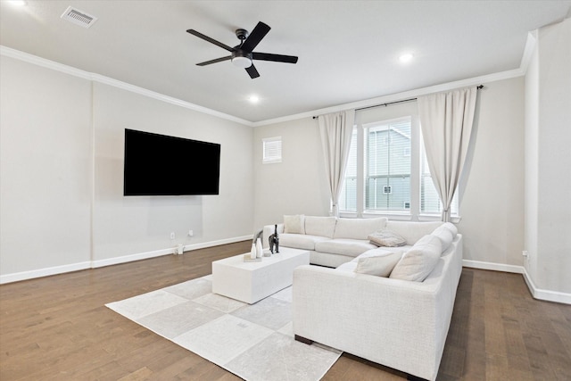 living room featuring crown molding, ceiling fan, and hardwood / wood-style floors