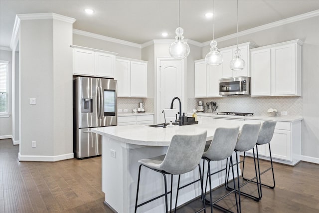 kitchen with white cabinetry, stainless steel appliances, dark hardwood / wood-style flooring, and a center island with sink