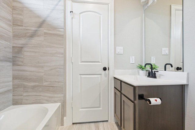 bathroom featuring hardwood / wood-style flooring and vanity