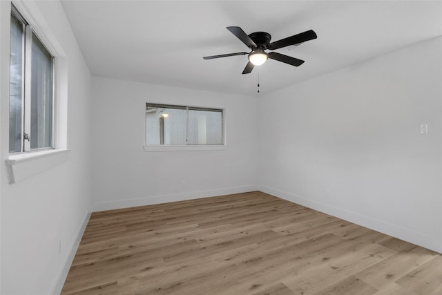 unfurnished room featuring light hardwood / wood-style floors and ceiling fan