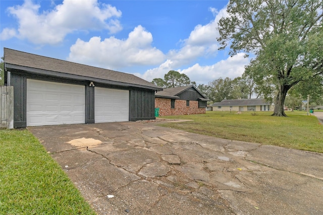 garage featuring a yard