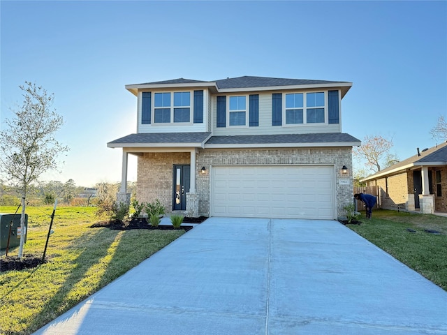 view of front facade featuring a garage and a front lawn