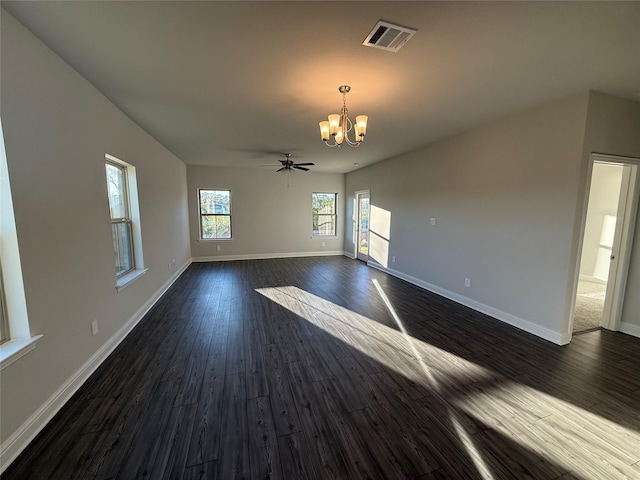 unfurnished room featuring dark hardwood / wood-style floors and ceiling fan with notable chandelier