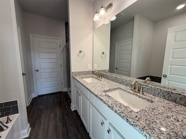 bathroom featuring hardwood / wood-style floors and vanity