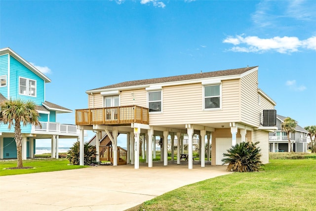 raised beach house featuring central AC unit, stairway, an attached garage, a carport, and a front yard