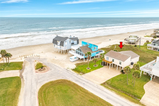 birds eye view of property featuring a water view and a view of the beach