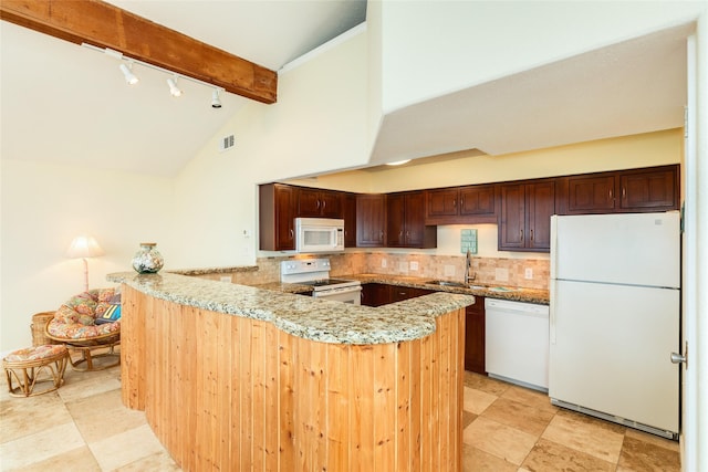 kitchen with white appliances, a sink, backsplash, and beamed ceiling