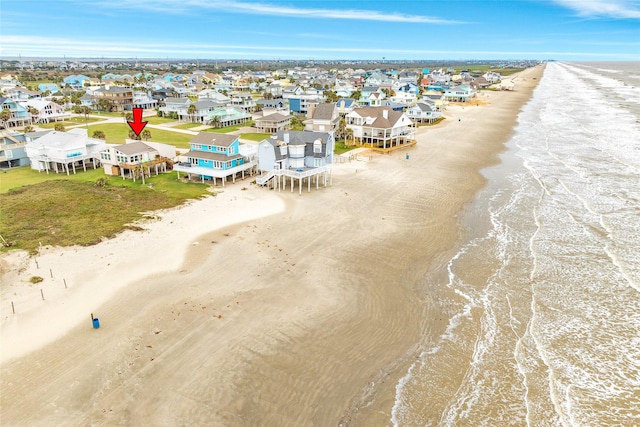 aerial view featuring a residential view, a water view, and a beach view