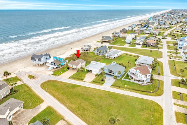 bird's eye view with a view of the beach, a water view, and a residential view