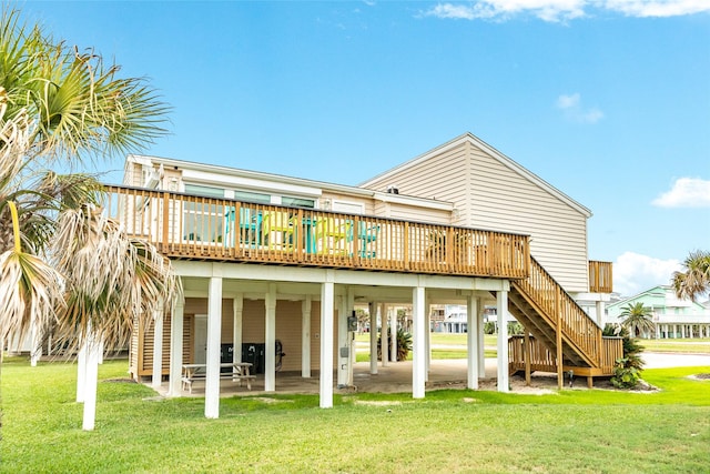 back of house with a deck, a lawn, a patio, and stairs