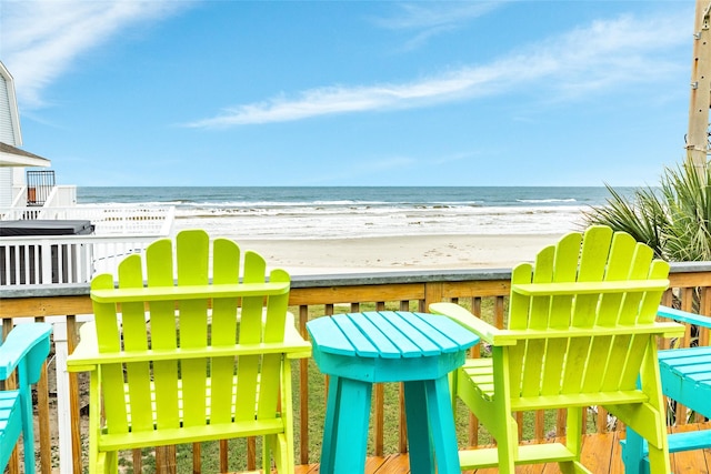 exterior space featuring a water view and a view of the beach