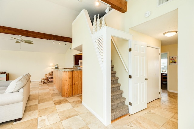 staircase with baseboards, visible vents, ceiling fan, and track lighting