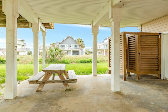 view of patio with outdoor dining area and a residential view