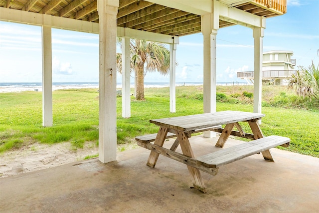 view of patio featuring outdoor dining space and a water view