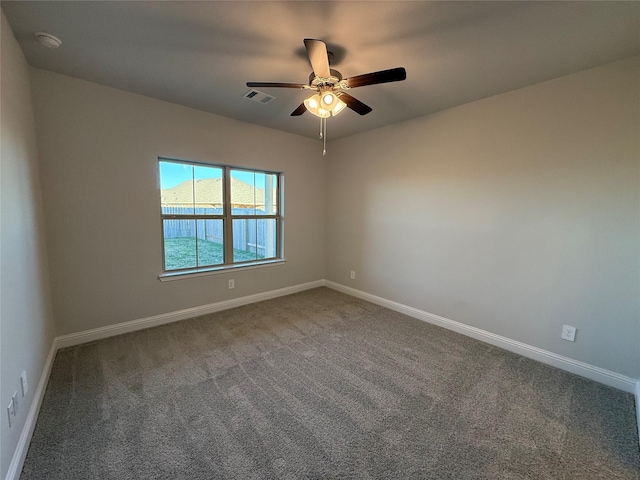 carpeted empty room with ceiling fan