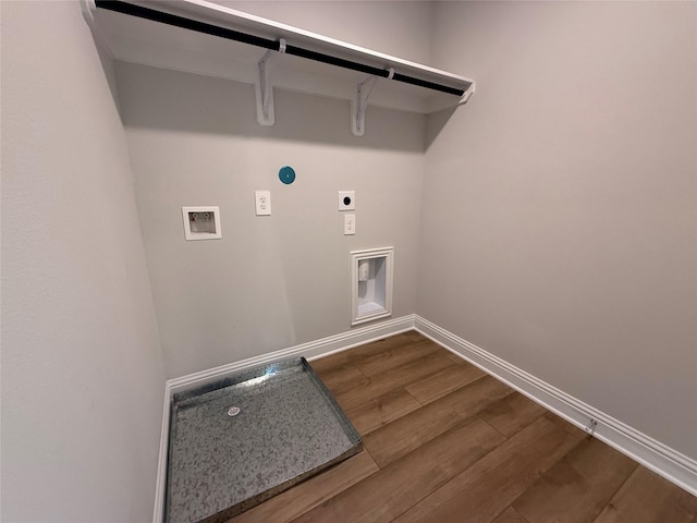 washroom featuring hookup for an electric dryer, wood-type flooring, and washer hookup